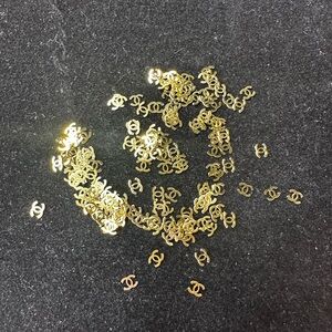 Gold Nail Logo Embellishments